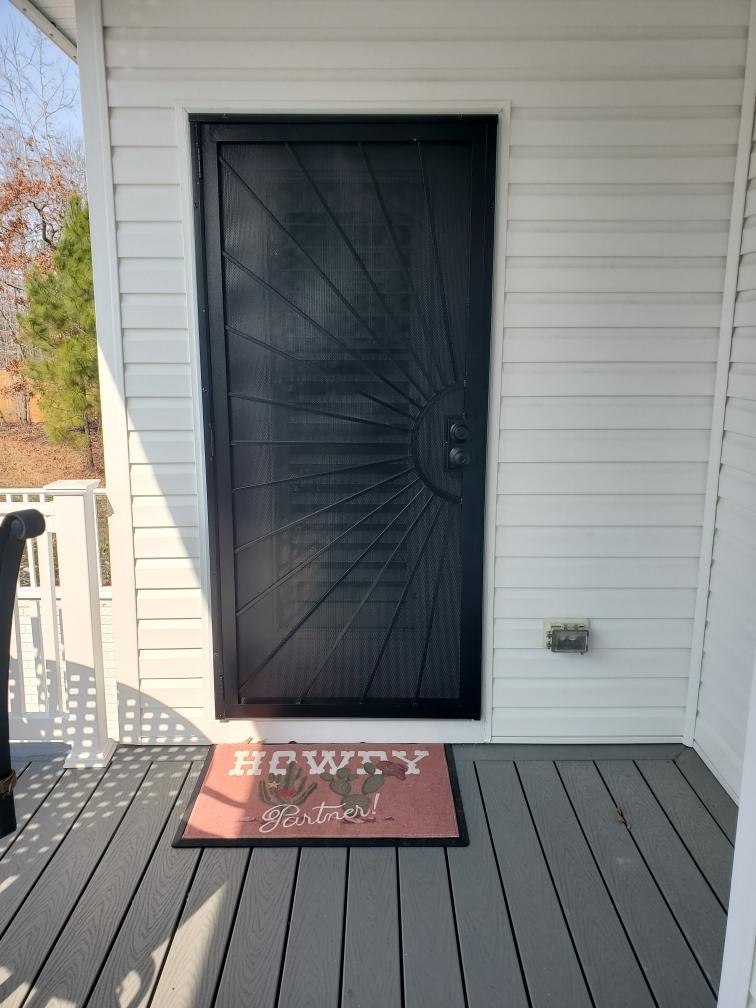 Custom sunburst security door at deck entry - Bradie's Custom Construction, Fredericksburg VA