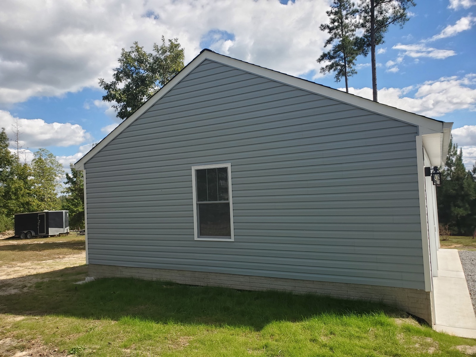 Gray-sided garage gable end with window - Bradie's Custom Construction, Fredericksburg VA