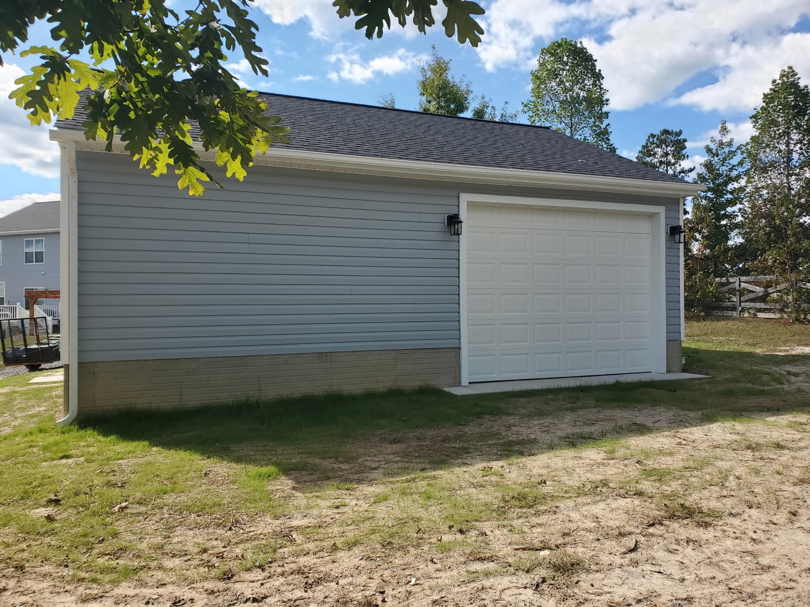 Gray-sided garage with side bay door - Bradie's Custom Construction, Fredericksburg VA
