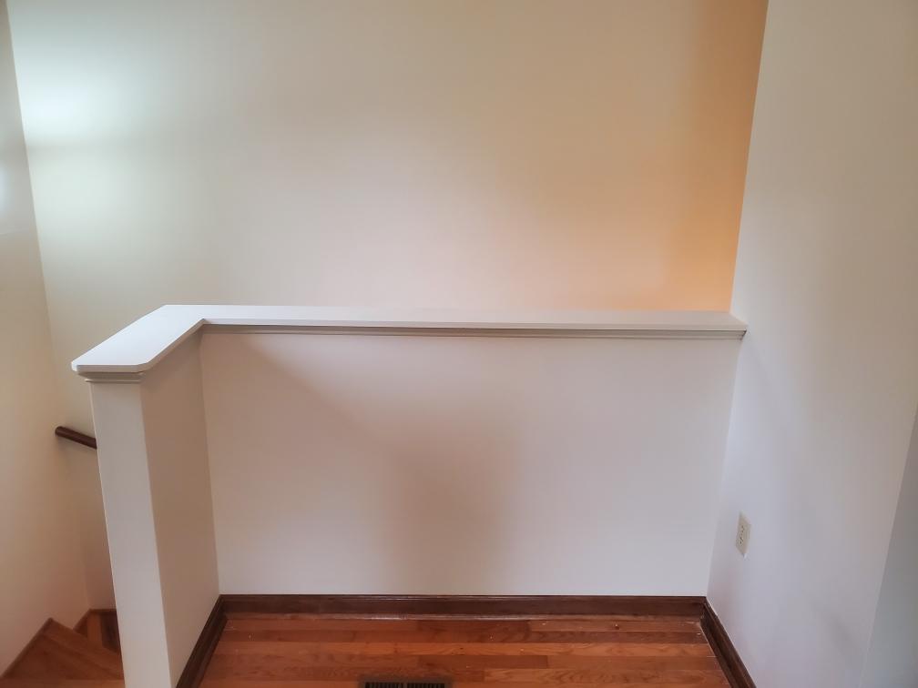 Refinished stairwell landing with fresh paint - Bradie's Custom Construction, Fredericksburg VA