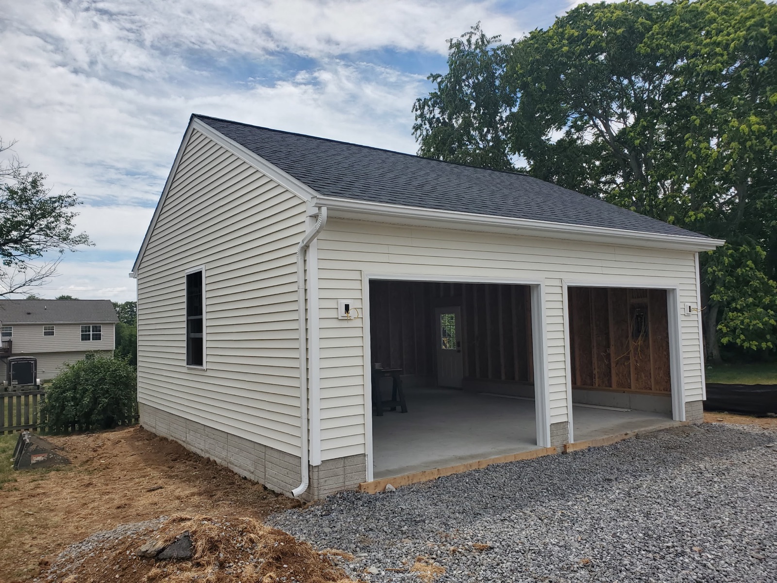 Two-car garage with downspout and side window - Bradie's Custom Construction, Fredericksburg VA