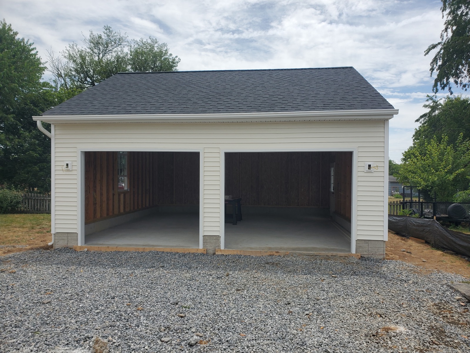 Two-car garage front with brick-look skirt - Bradie's Custom Construction, Fredericksburg VA