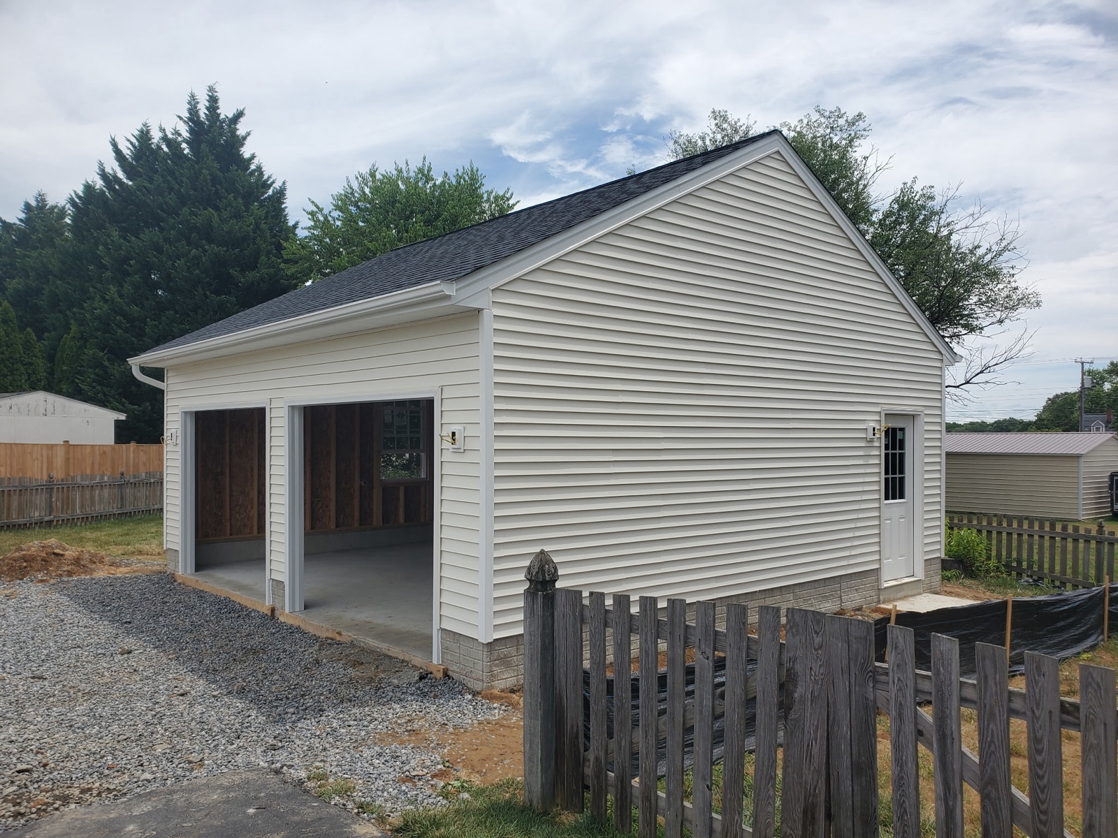 Detached two-car garage with gutters and side door - Bradie's Custom Construction, Fredericksburg VA
