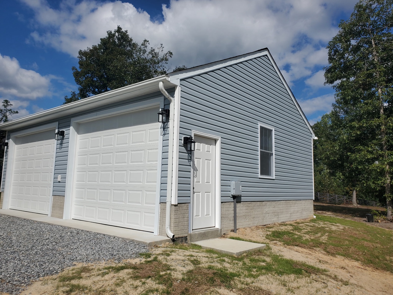 Two-car garage with side entry door and window - Bradie's Custom Construction, Fredericksburg VA